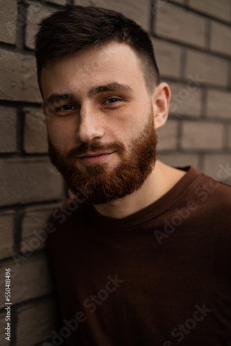 Young handsome man with a red beard, portrait, close-up.