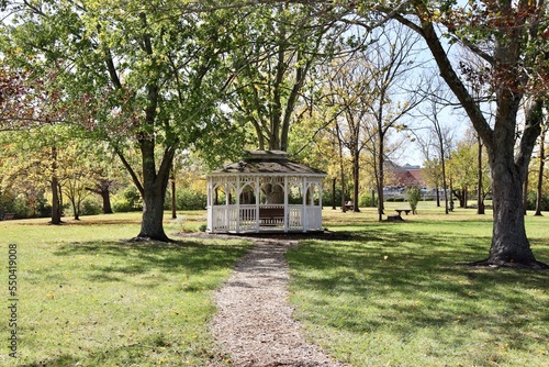 The white gazebo in the countryside on a sunny day.