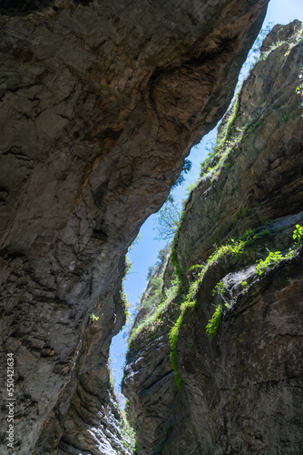Beautiful curved crevice in canyon in sunny weather. Wide angle view of amazing sandstone formations in Salta gorge in mountains of Dagestan, Russia.