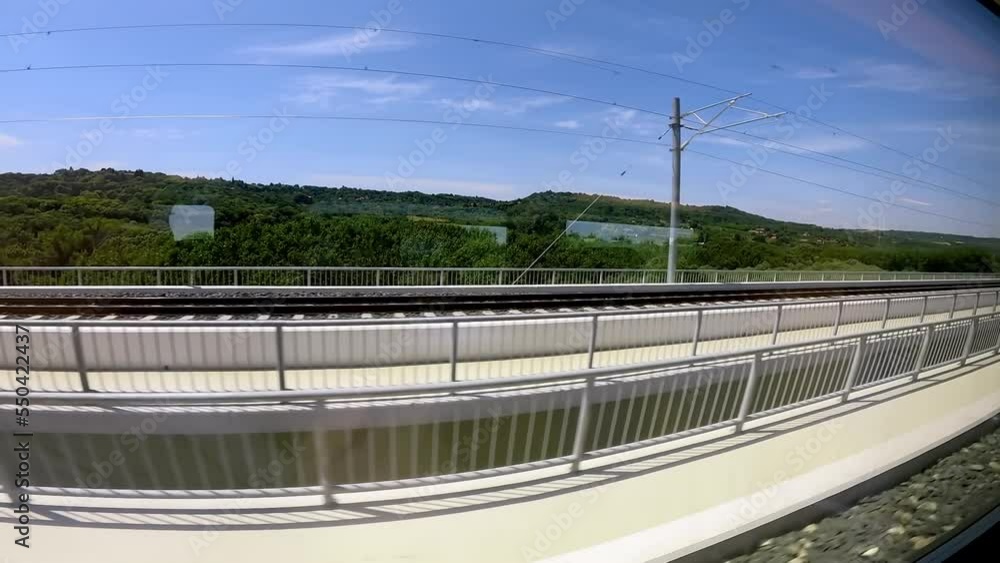 Panoramically view over landscape trough the window of fast driving train. Panoramically view over landscape trough the window of fast driving train.
