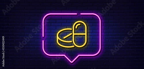 Neon light speech bubble. Medical drugs line icon. Medicine pills sign. Pharmacy medication symbol. Neon light background. Medical drugs glow line. Brick wall banner. Vector