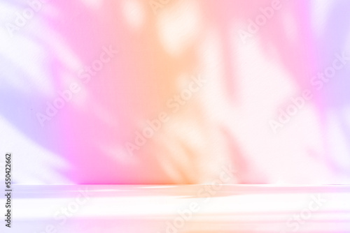 Fototapeta Naklejka Na Ścianę i Meble -  Abstract gradient pink studio background for product presentation. Empty room with shadows of window and flowers and palm leaves . 3d room with copy space. Summer concert. Blurred backdrop.