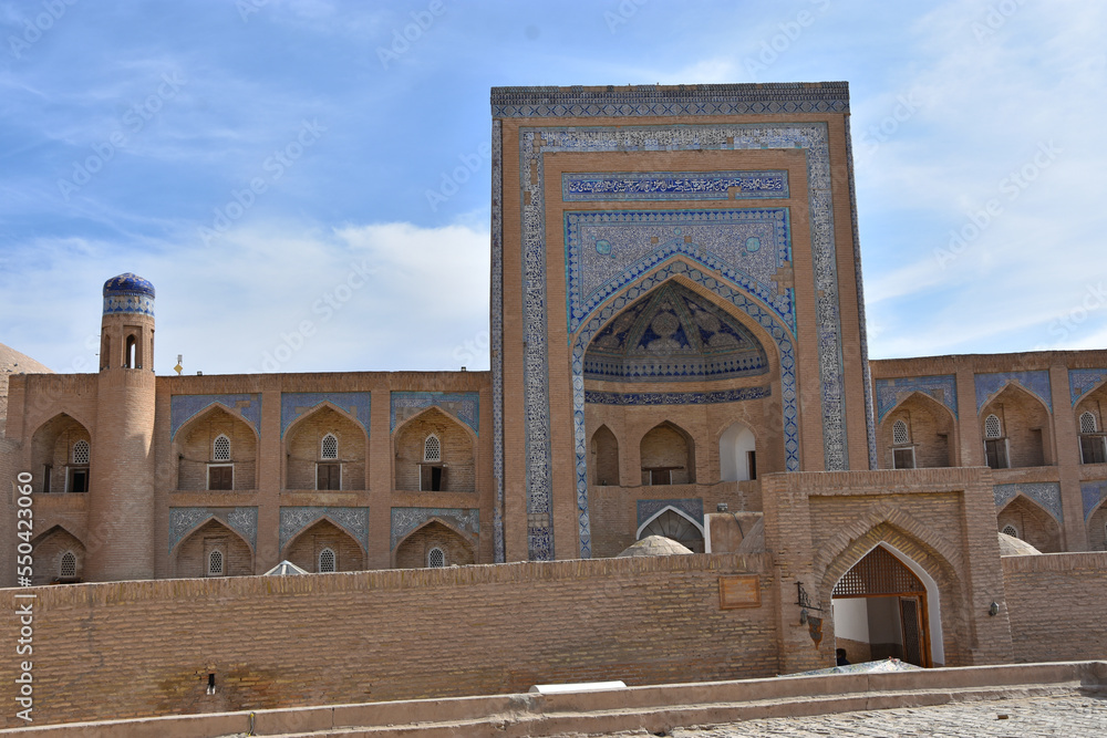 Madrassah of Ala-Kuli Khan in oriental style in the old city of Khiva (Xiva) in Uzbekistan