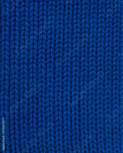 Woolen blue knitted warm texture fabric background