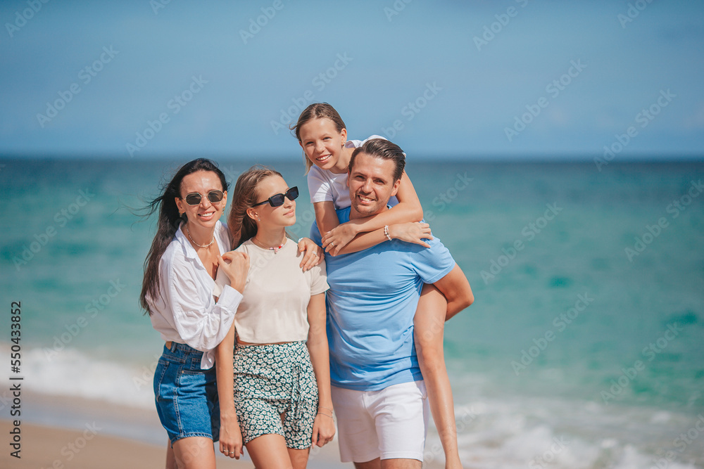 Happy family on the beach during summer vacation Happy family on the beach during summer vacation