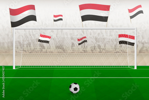 Yemen football team fans with flags of Yemen cheering on stadium, penalty kick concept in a soccer match.