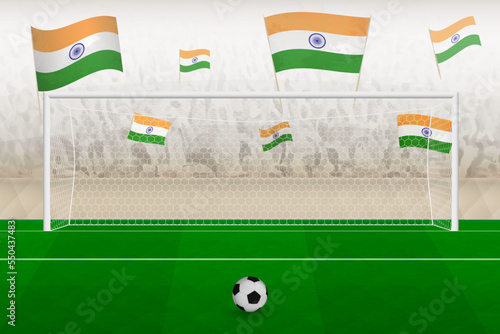 India football team fans with flags of India cheering on stadium, penalty kick concept in a soccer match.