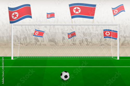 North Korea football team fans with flags of North Korea cheering on stadium, penalty kick concept in a soccer match.