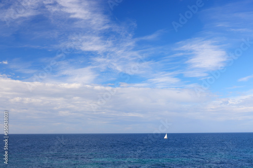 Lonely Sailing boat on blue open sea in Apulia, Italy.  © Rechitan Sorin
