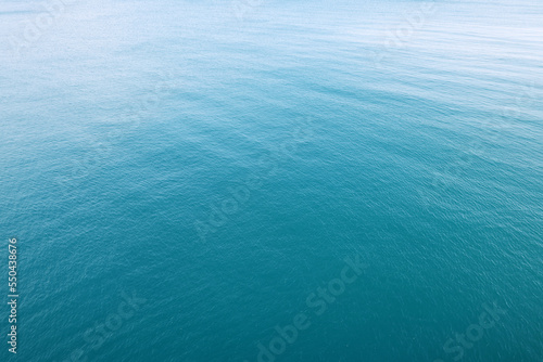 Aerial view of a clear sea water texture. Natural blue background. Blue water reflection. Mediterranean sea. 