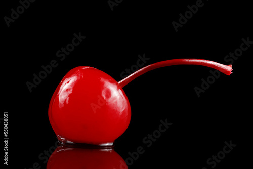 Konstfotografi Cocktail cherry with stalk on black.