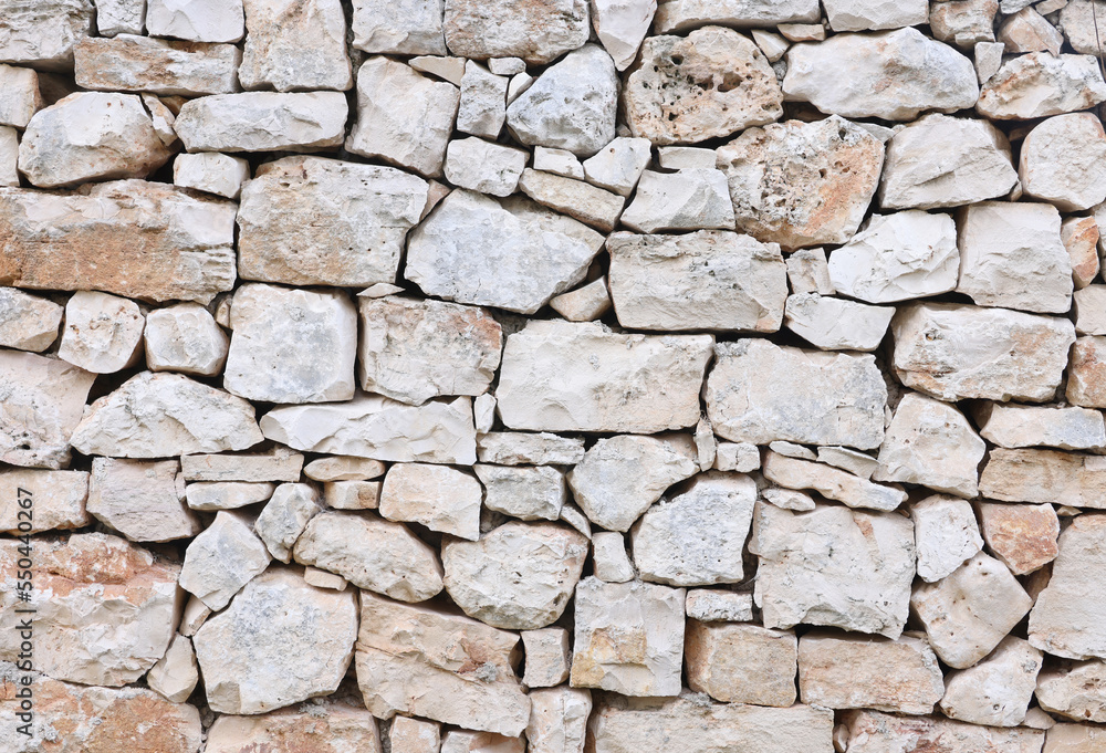 Realistic stone background. The natural texture of stone. Granite wall background, concrete texture. Stone mosaic. Realistic stone background. The natural texture of stone. Granite wall background, concrete texture. Stone mosaic.
