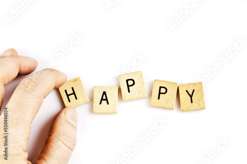 forming the word HAPPY with tiles
