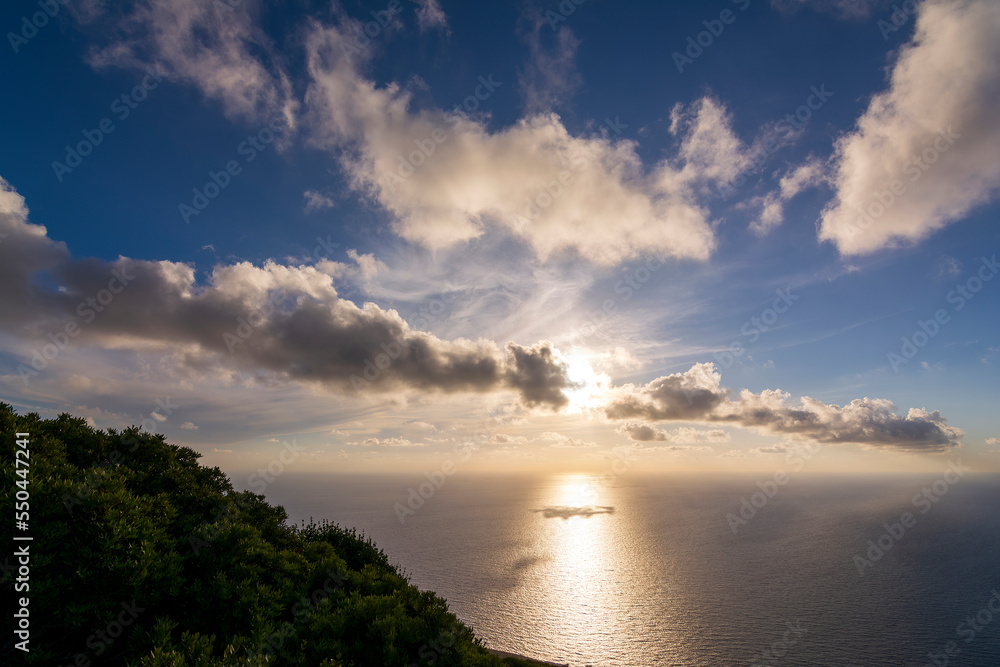 Dramatic colorful sunset sky with clouds over the sea Dramatic colorful sunset sky with clouds over the sea