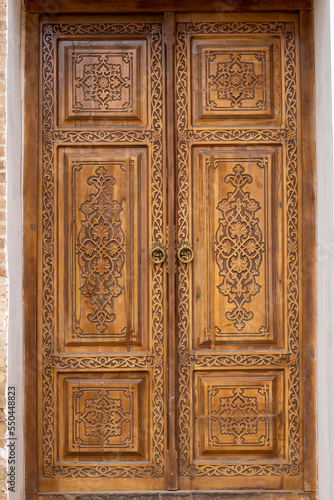 A carved wooden door from the walnut wood