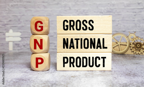 Paper with GNP Gross National Product on a table with charts