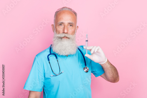 Photo of qualified man doc pediatrician hold syringe vaccine against sars covid 19 isolated pastel color background