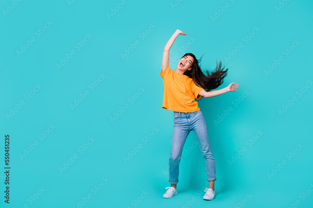 Full size photo of impressed brunette lady dance wear t-shirt jeans boots isolated on turquoise color background Full size photo of impressed brunette lady dance wear t-shirt jeans boots isolated on turquoise color background