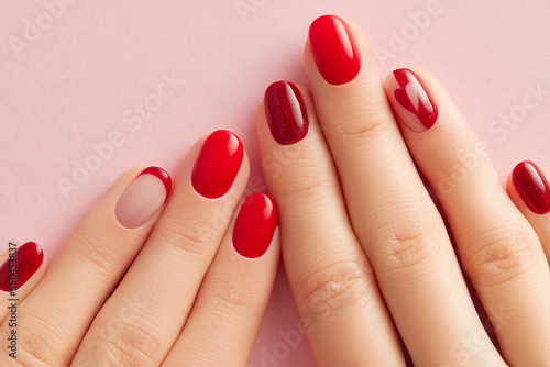 Photography Female hands with manicure on pink background