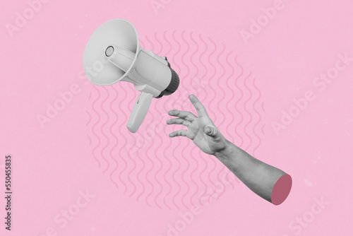 Hand catching a flying loudspeaker on a creative abstract pink background