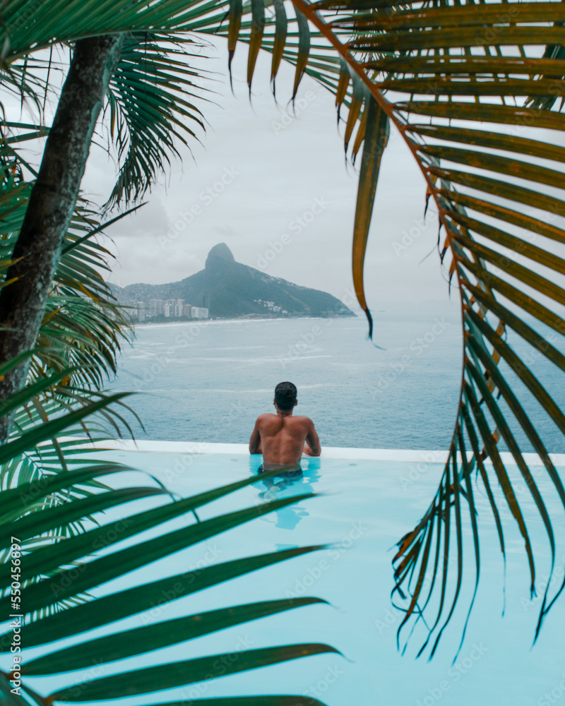 person relaxing on a luxury infinite pool
