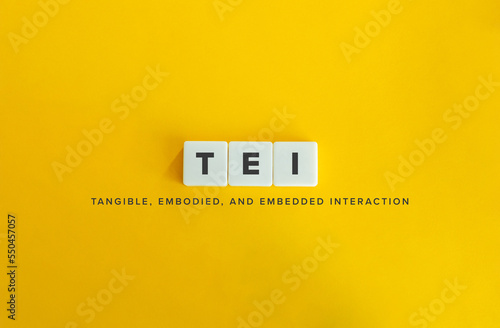 Tangible, Embodied, and Embedded Interaction (TEI). Letter Tiles on Yellow Background. Minimal Aesthetics.