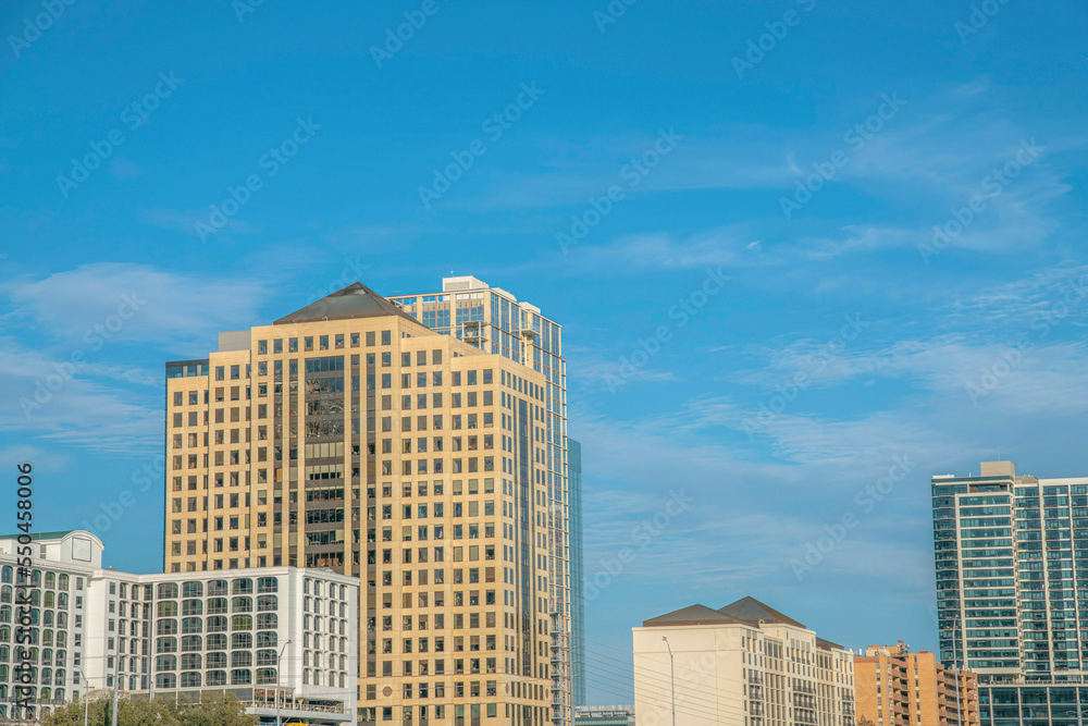 The city skyline of Austin Texas with blue sky background on a sunny day