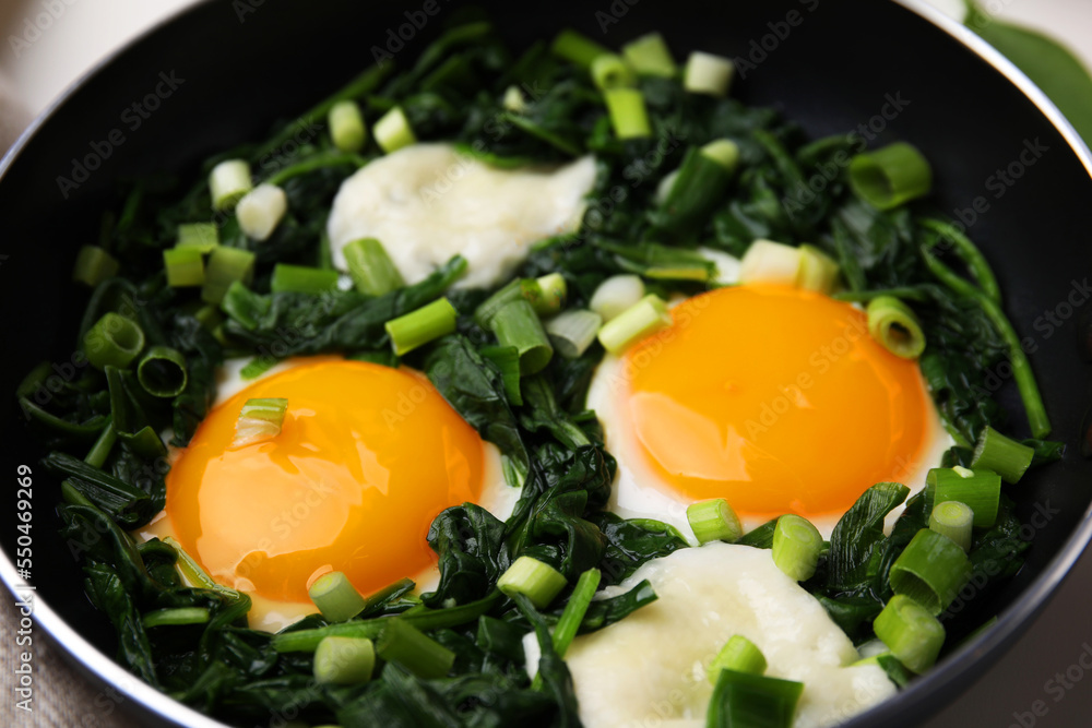 Tasty green Shakshouka in frying pan, closeup Tasty green Shakshouka in frying pan, closeup