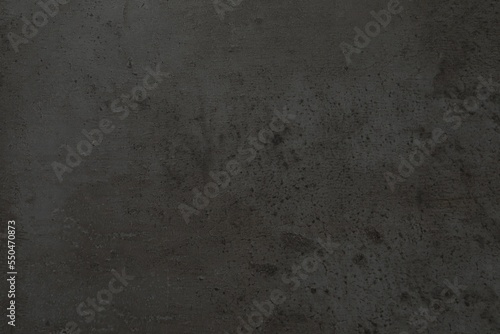 Obraz na plátně Dark grey stone surface as background, closeup view