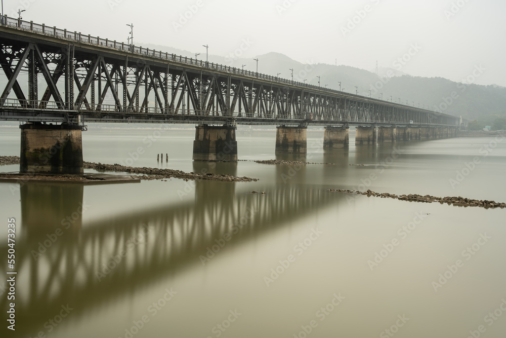 The Qiantang River Bridge in the fog.