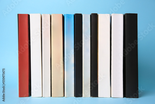 Collection of books on light blue background