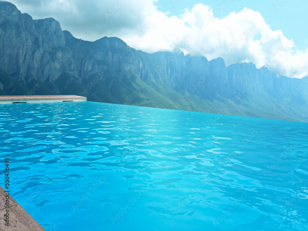 Outdoor swimming pool at luxury resort with beautiful view of mountains