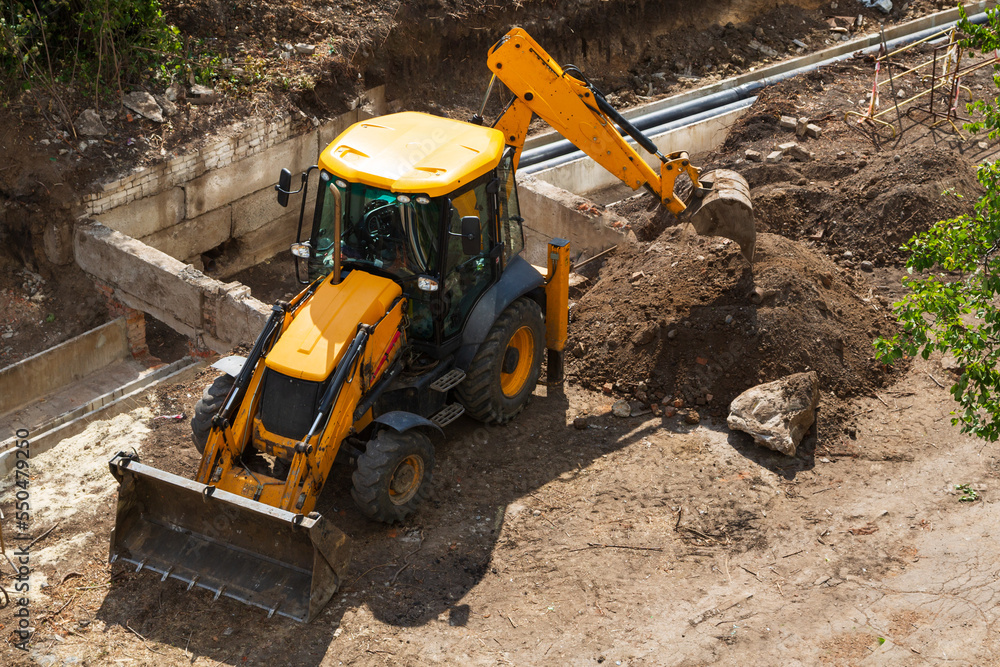 Construction work using an excavator. Construction work using an excavator.