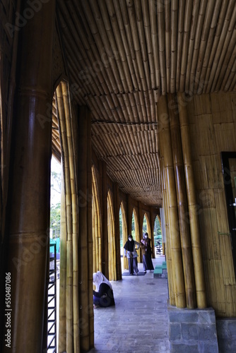 the Kiram mosque on Banjarbaru, indonesia, the walls are made of woven bamboo and the roof is made from dried straw leaves photo