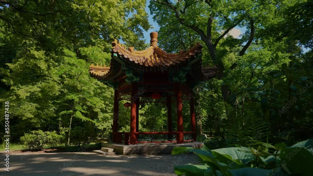 Chinese (Asian) Garden (Ogród Chiński) Łazienki Park or Royal Baths Park. Chinese alley walking route in Łazienki, located exactly at the central axis of the park. Gazebo. Chinese (Asian) Garden (Ogród Chiński) Łazienki Park or Royal Baths Park. Chinese alley walking route in Łazienki, located exactly at the central axis of the park. Gazebo.