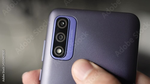 Closeup on a Smartphone With Multiple Cameras on the Back photo