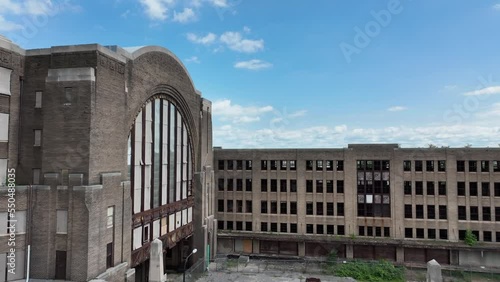 An aerial view of the green city of Buffalo, New York of a beautiful summer day with the Grand Central Station and railroad yard in the background.