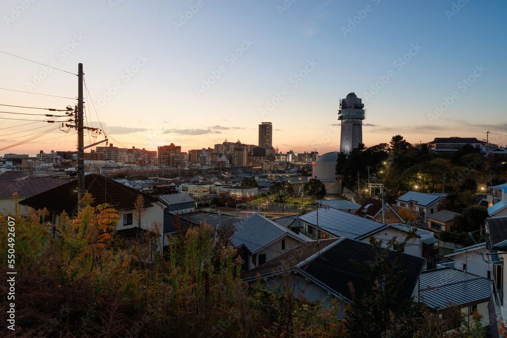Sunset on residential neighborhood and tower overlooking Akashi City