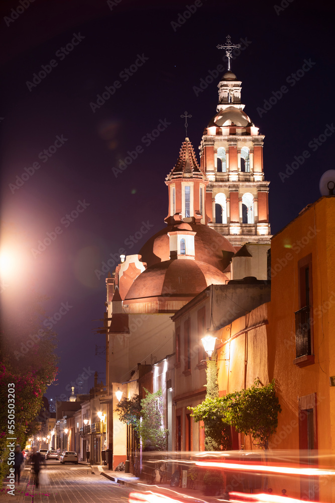 Twilight view of the Spanish colonial architecture and historic church of downtown Santiago de Querétaro, Mexico.
