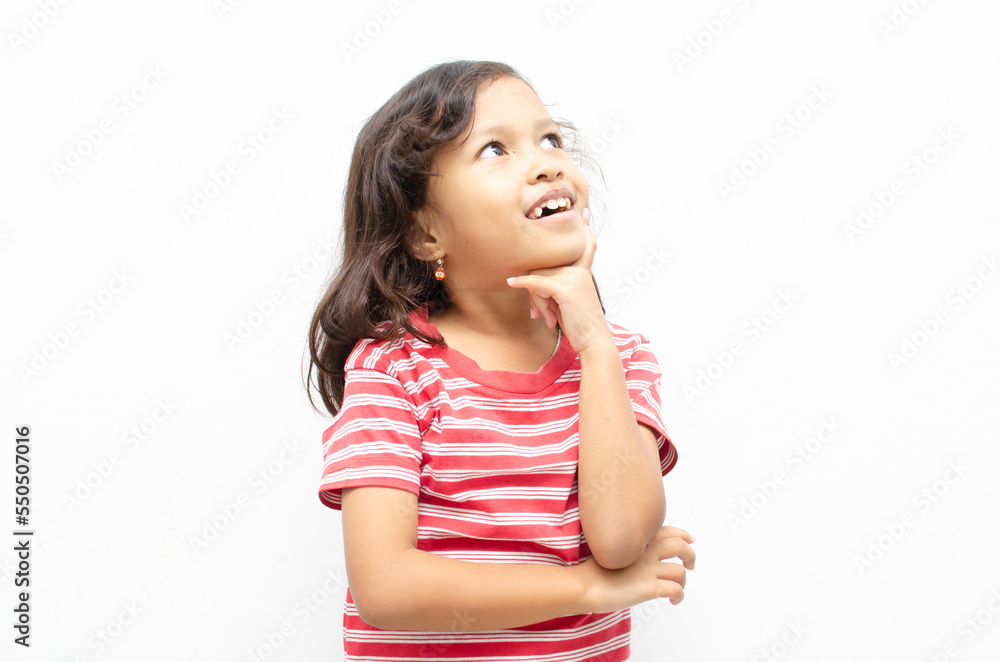 portrait of smilling asian little girl pose thinking gesture with happy expression portrait of smilling asian little girl pose thinking gesture with happy expression