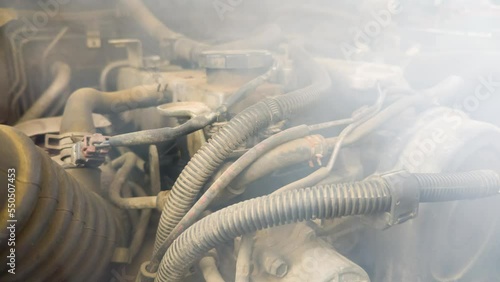 Smoke coming out the broken car engine