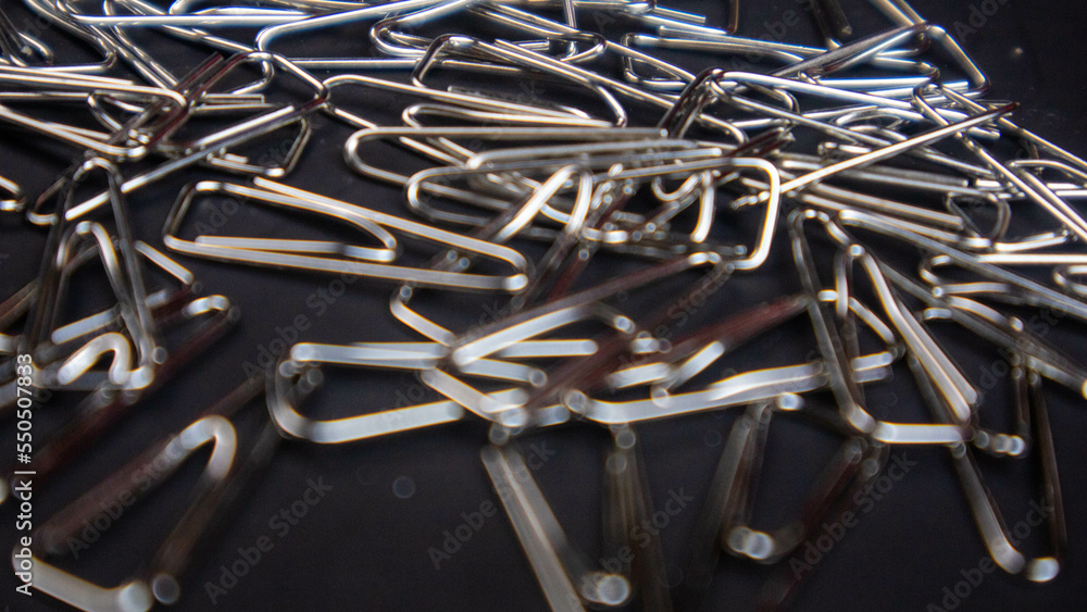 a paper clip on a black background a paper clip on a black background