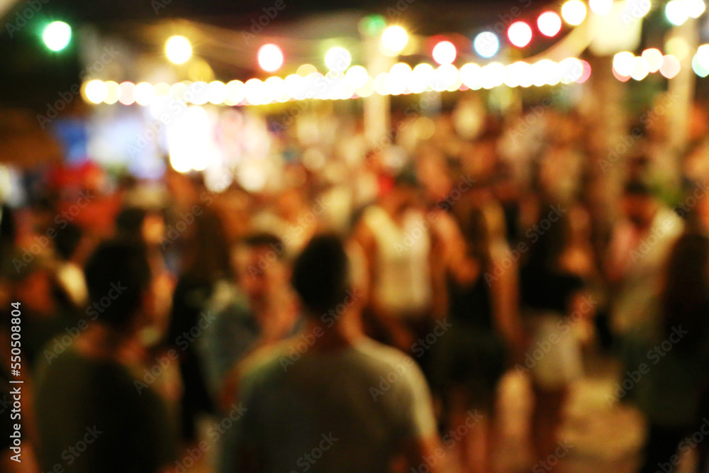 Blurred background of many people had fun at a beach party Blurred background of many people had fun at a beach party
