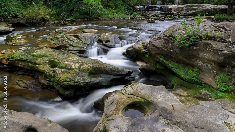 Fototapeta premium Running water through rocks at Berea falls scenic area in Ohio.