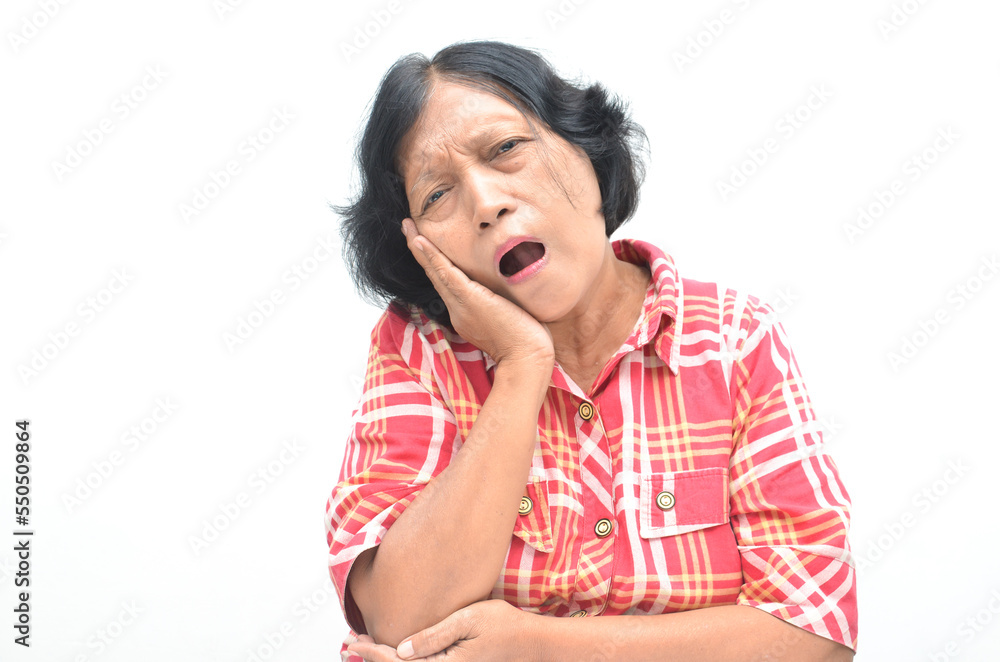 old senior asian woman touching cheeck suffering from toothache old senior asian woman touching cheeck suffering from toothache