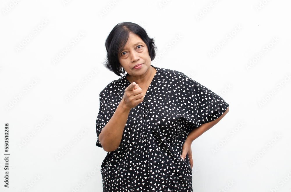 Portrait of happy ecstatic senior asian woman pointing finger and hand presenting gesture giving advice and suggestion Portrait of happy ecstatic senior asian woman pointing finger and hand presenting gesture giving advice and suggestion