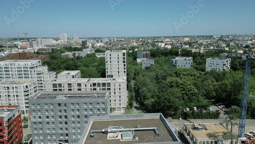 Modern condominiums of La Courrouze eco-district, Rennes city, Brittany in France. Aerial forward. Sky for copy space photo