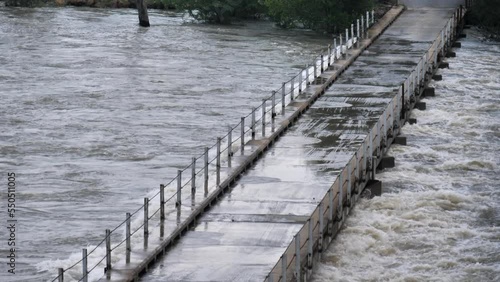 Wallpaper Mural Low single lane bridge across flooding river has water up to the deck Torontodigital.ca