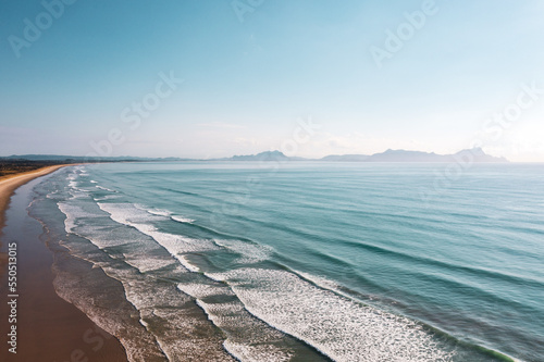 Big waves at New Zealand blue-water Uretiti Beach photo