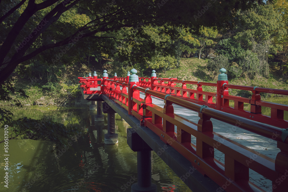 Traditional Japanese red bridge with greenery Traditional Japanese red bridge with greenery